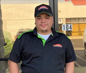 Technician standing in front of SERVPRO office
