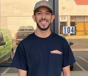 Technician standing in front of SERVPRO office