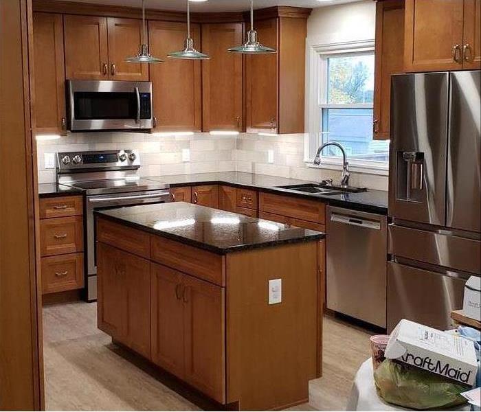 Remodeled kitchen with new appliances. 